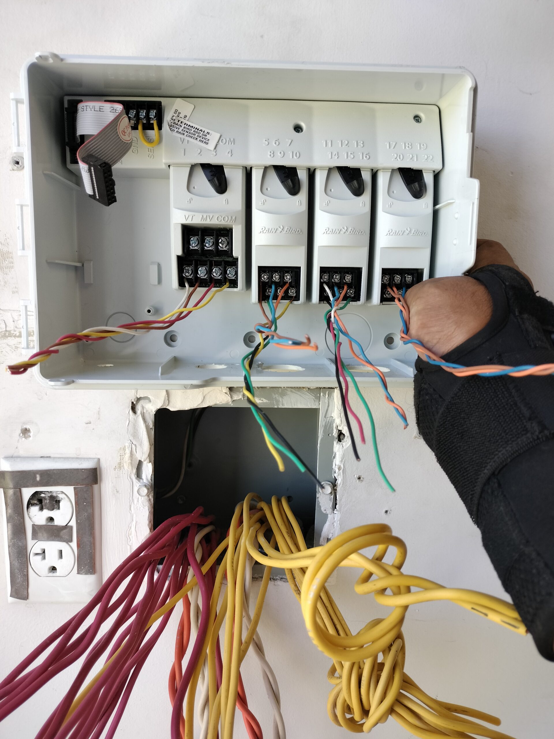 Rain Bird irrigation controller modules with exposed wiring during service